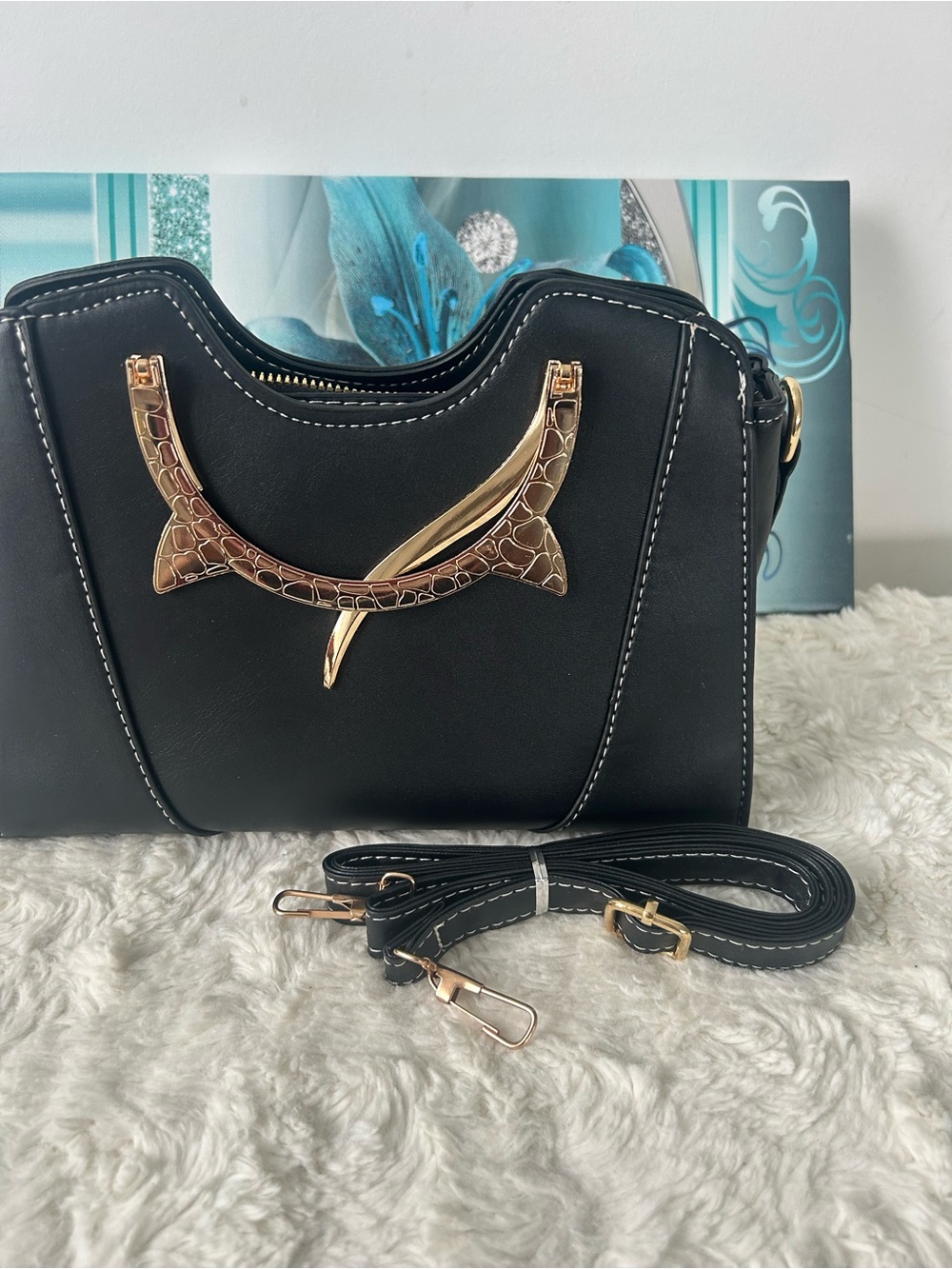 Black Crossbody Bag with Gold Accent Detailing